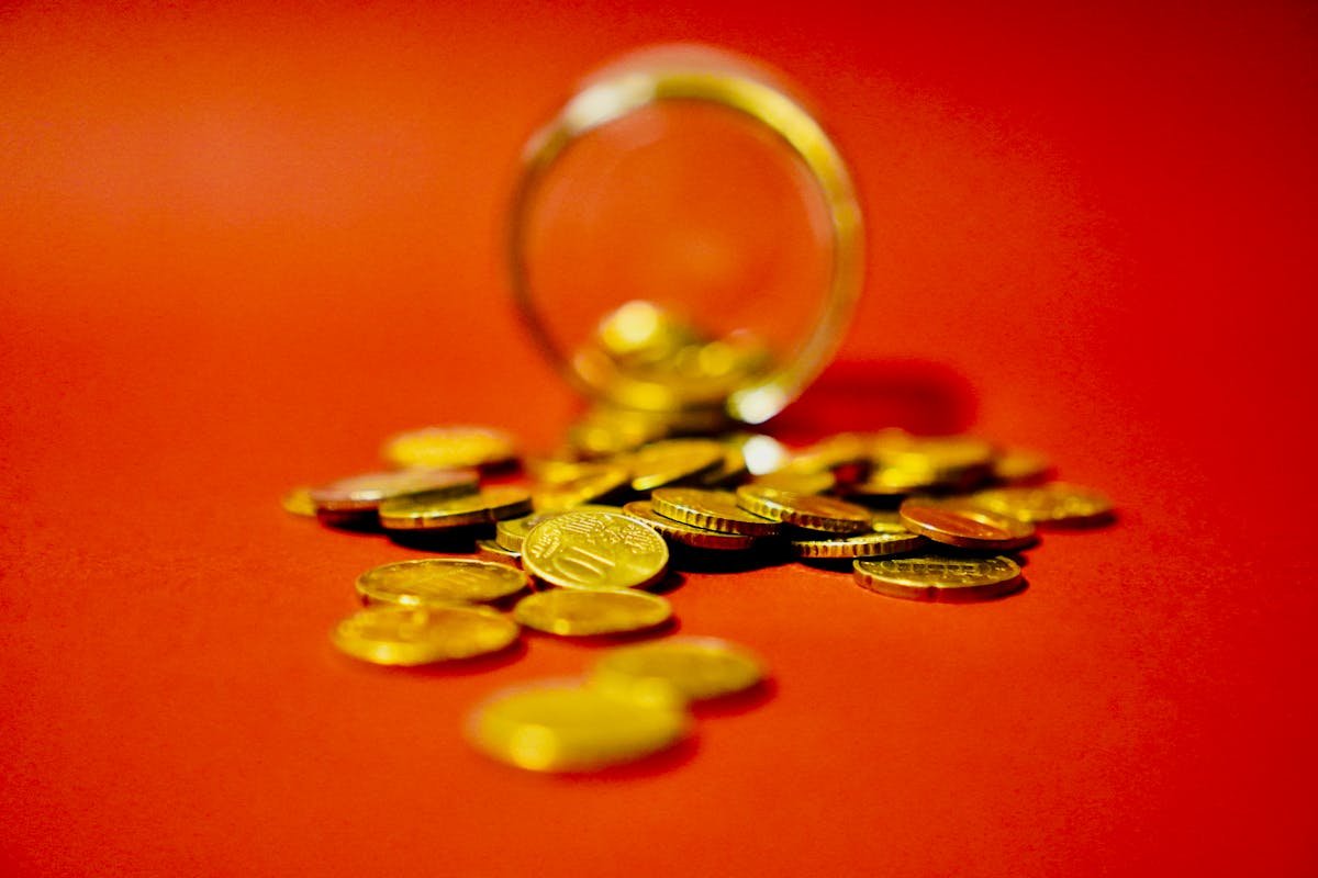 Gold coins and treasure representing alternative asset investment risks in unregulated markets